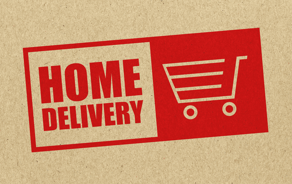 Red home delivery stamp with a shopping cart icon on a textured cardboard background, indicating nationwide shipping.