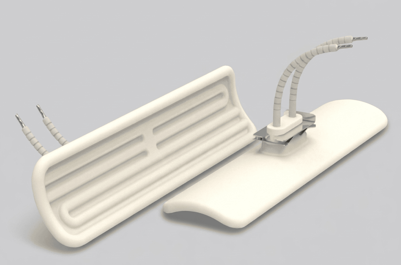 Two white ceramic industrial infrared heating elements, showing the front heat-radiating surface and the back electrical wiring.